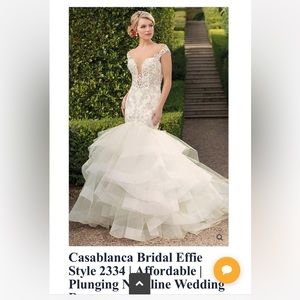 Selling an unworn wedding dress. Still in garment bag with tags
